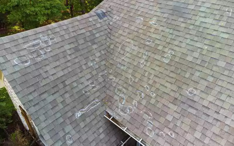 damaged-roof-with-chalk-marks